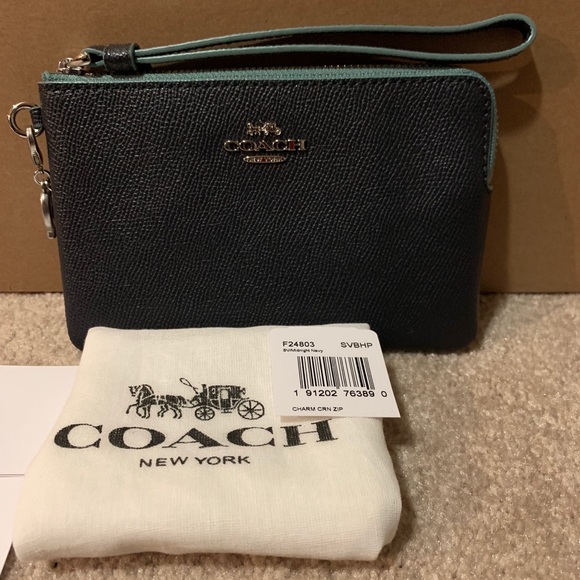 Coach Handbags - NWT Authentic Coach Leather Wristlet with charm